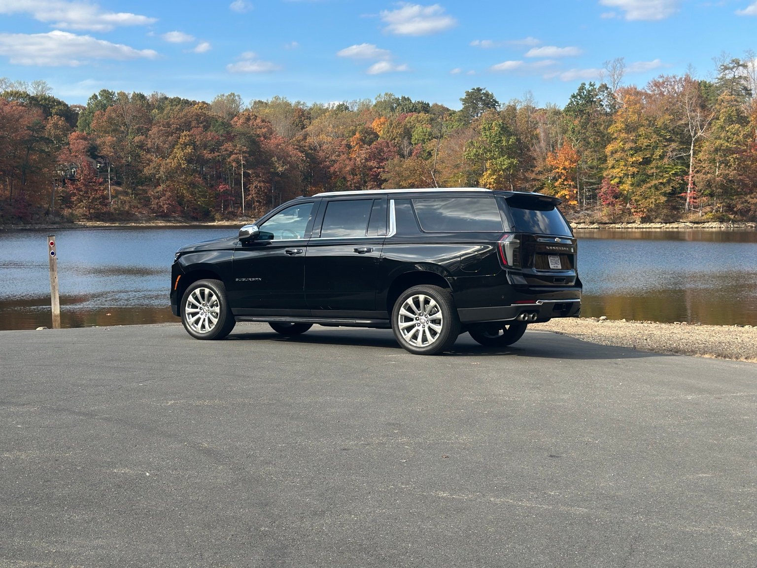 Our black Chevrolet Suburban beside a lake
